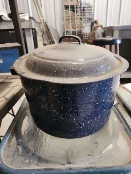 vintage blue and white speckled enamelware stock pot with a matching lid