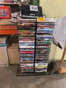 (80): DVD RACK CONTAINING 80 DVD'S ACTION/HORROR/COMEDY