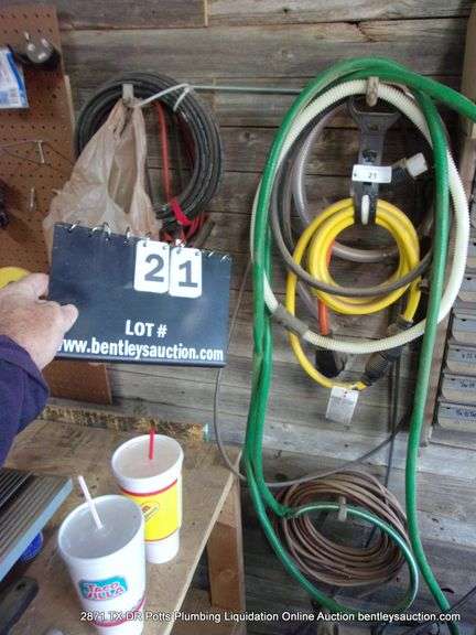LOT: WALL HANGING ITEMS - CORDS COPPER, JUMPER CABLES