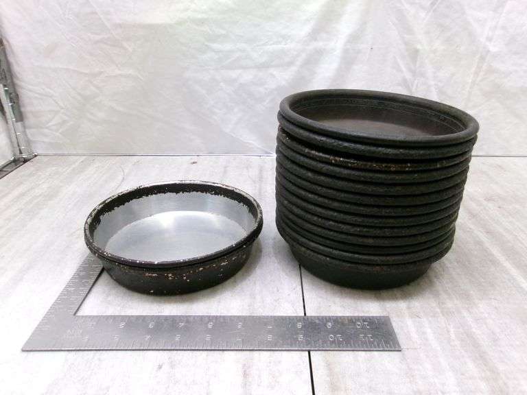 STACK OF SMALL STOVE DRUM COVERS