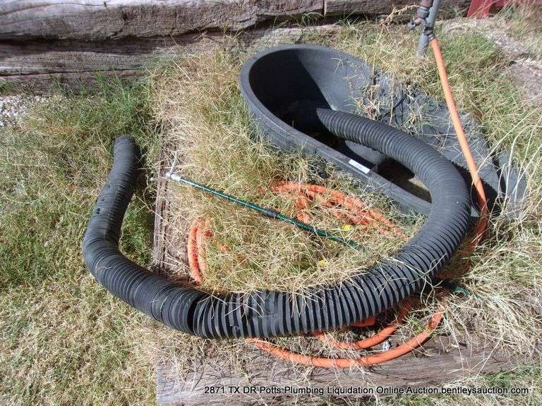 LOT: BLACK TUB W/ HOSES AND SPRINKLER