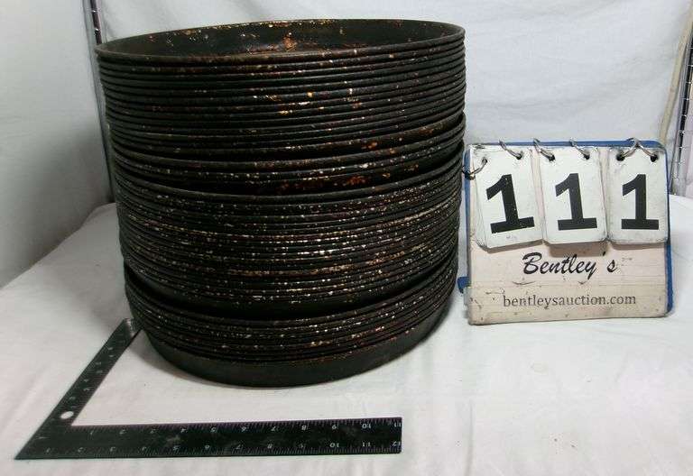 STACK OF LARGE STOVE DRUM COVERS