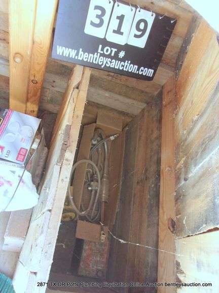 CONTENTS OF WOOD BOXES IN CORNERS - SPRINKLER, BATTERY, FLOWERING SUPPLIES