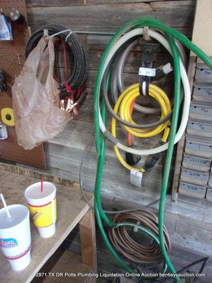LOT: WALL HANGING ITEMS - CORDS COPPER, JUMPER CABLES