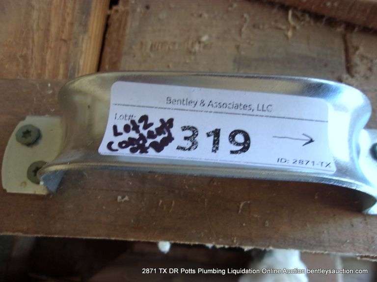 CONTENTS OF WOOD BOXES IN CORNERS - SPRINKLER, BATTERY, FLOWERING SUPPLIES