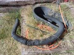 LOT: BLACK TUB W/ HOSES AND SPRINKLER