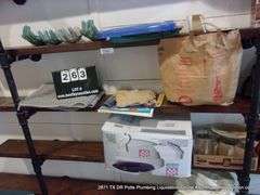 CONTENTS OF SHELVES: TUPPERWARE LIDS, GULF WAX, STICKERS, HAND DÉCOR, GLASS JARS, HEAT BATH