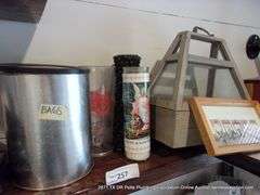 CONTENTS OF SHELF: BAGS, OLD PHONES, WONDER WOMAN FUNKO POP, CANDLES, PICTURE FRAMES