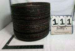 STACK OF LARGE STOVE DRUM COVERS