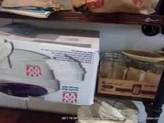 CONTENTS OF SHELVES: TUPPERWARE LIDS, GULF WAX, STICKERS, HAND DÉCOR, GLASS JARS, HEAT BATH