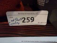 CONTENTS OF SHELF: THROW BLANKET, NECK PILLOW, MENS UNDERWEAR, CAMCORDER IN GREEN BAG