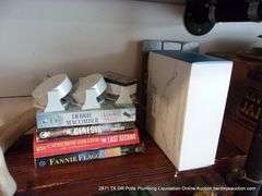 CONTENTS OF SHELF: HATS, COLOGNE, BOOKS, HORN, DOG HARNESS, I-ZOOM