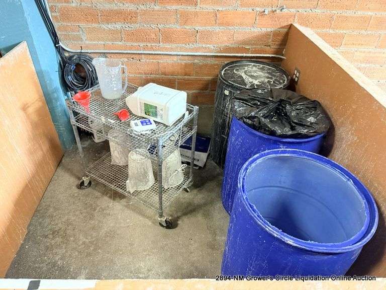 SQUARE AREA OF PLASTIC BARRELS AND METAL CART