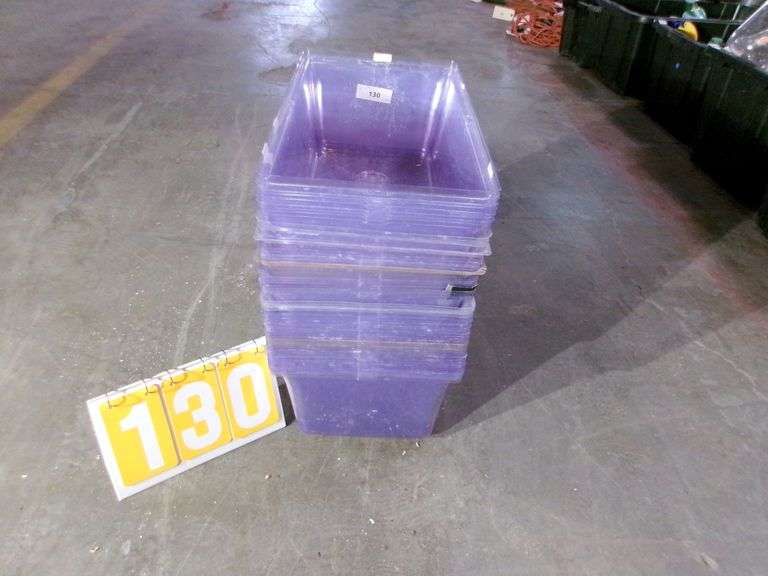 STACK OF CLEAR PLASTIC STORAGE BINS