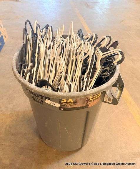 SMALL TRASH BIN FULL OF HANGERS