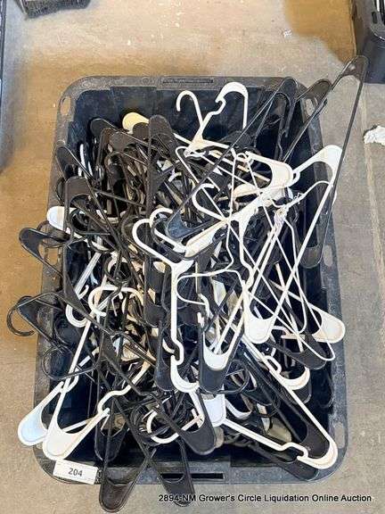 BLACK TOTE FULL OF HANGERS