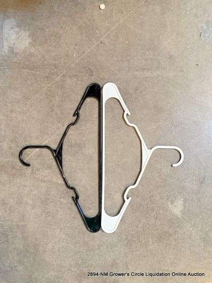 SMALL TRASH BIN FULL OF HANGERS