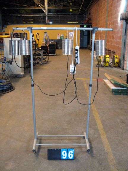 SILVER GARMENT RACK W/ CAN HEATERS