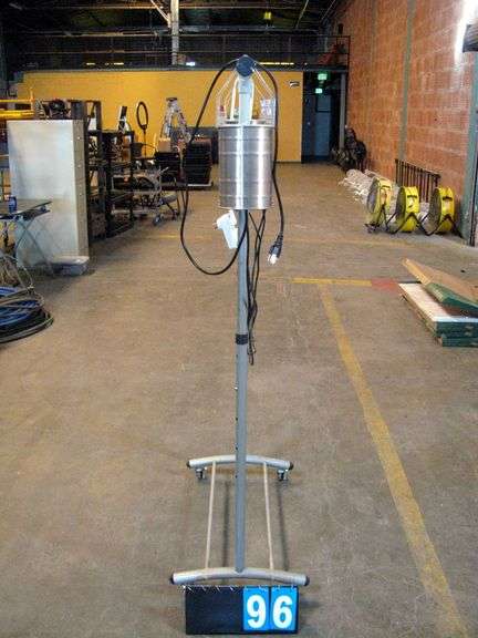 SILVER GARMENT RACK W/ CAN HEATERS