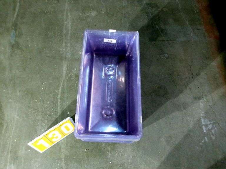 STACK OF CLEAR PLASTIC STORAGE BINS