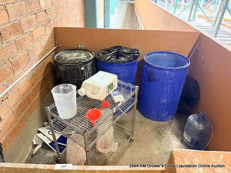 SQUARE AREA OF PLASTIC BARRELS AND METAL CART