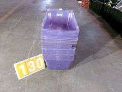 STACK OF CLEAR PLASTIC STORAGE BINS