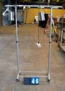 METAL CLOTHING RACK ON WHEELS: MISC GROWING ITEM