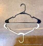 BLACK TOTE FULL OF HANGERS