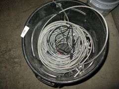 BLACK BRUTE TRASHCAN W/ MISC. CABLE