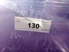 STACK OF CLEAR PLASTIC STORAGE BINS