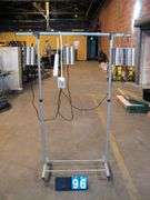 SILVER GARMENT RACK W/ CAN HEATERS