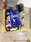 BLACK TOTE W/ MISC. ITEMS AND WATER PUMP