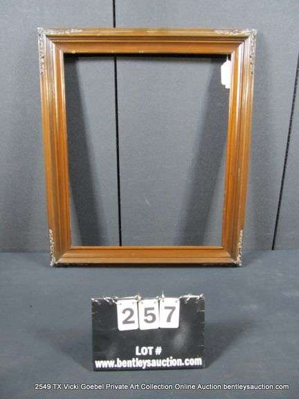DARK-STAINED, CARVED WOODEN FRAME 25 X 29