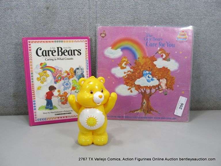 LOT: (3) CARE BEARS MERCH "CARE FOR YOU" VINYL, SUNSHINE BEAR & BOOK
