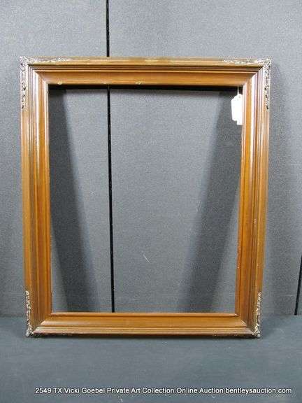 DARK-STAINED, CARVED WOODEN FRAME 25 X 29