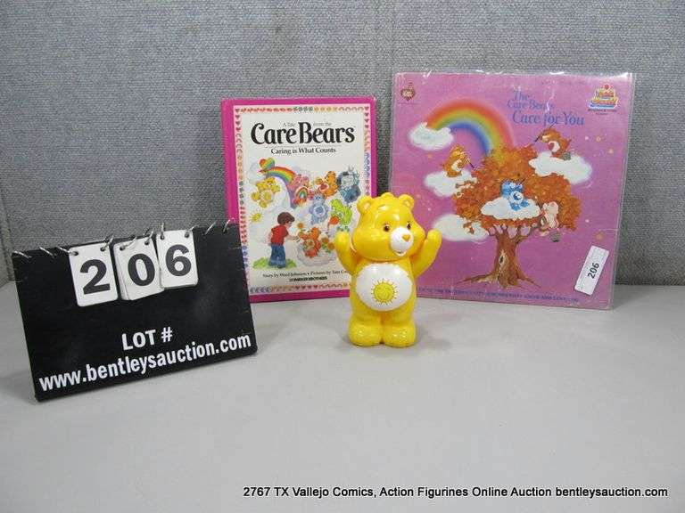 LOT: (3) CARE BEARS MERCH "CARE FOR YOU" VINYL, SUNSHINE BEAR & BOOK
