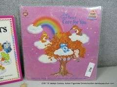 LOT: (3) CARE BEARS MERCH "CARE FOR YOU" VINYL, SUNSHINE BEAR & BOOK