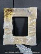 GOLD PAINTED, W/ LINEN INLAY, CARVED ORNATE WOODEN FRAME - (WRAPPED IN PLASTIC) 21 X 24