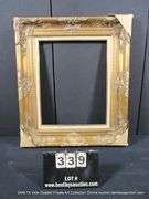 GOLD PAINTED, W/ HEATHERED LINEN INLAY, CARVED ORNATE WOODEN FRAME 26 X 30