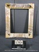 BRONZE PAINTED CARVED ORNATE WOODEN FRAME (WRAPPED IN PLASTIC) 28 X 32