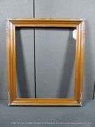 DARK-STAINED, CARVED WOODEN FRAME 25 X 29