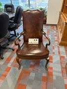 BROWN LEATHER ARM CHAIR