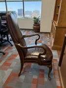 BROWN LEATHER ARM CHAIR