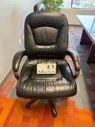 BLACK LEATHER ARM CHAIR W/ CASTERS