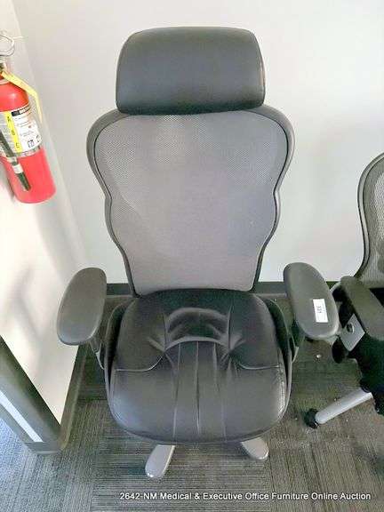 BLACK LEATHER OFFICE CHAIR ON CASTERS