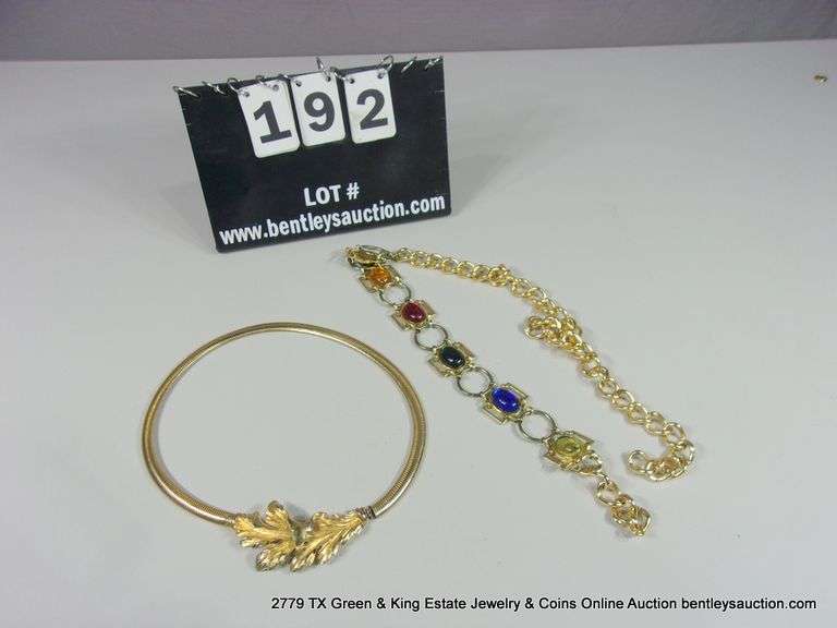BAG: 2 FASHION GOLD TONE BELTS, 1 W/ LEAF PATTERN, 1 W/ COLORED GLASS STONES