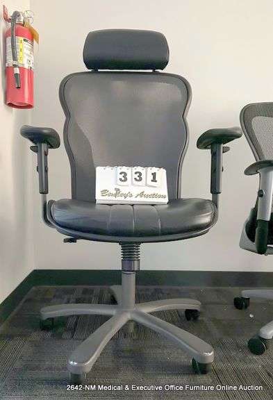 BLACK LEATHER OFFICE CHAIR ON CASTERS