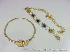 BAG: 2 FASHION GOLD TONE BELTS, 1 W/ LEAF PATTERN, 1 W/ COLORED GLASS STONES