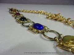 BAG: 2 FASHION GOLD TONE BELTS, 1 W/ LEAF PATTERN, 1 W/ COLORED GLASS STONES