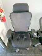 BLACK LEATHER OFFICE CHAIR ON CASTERS